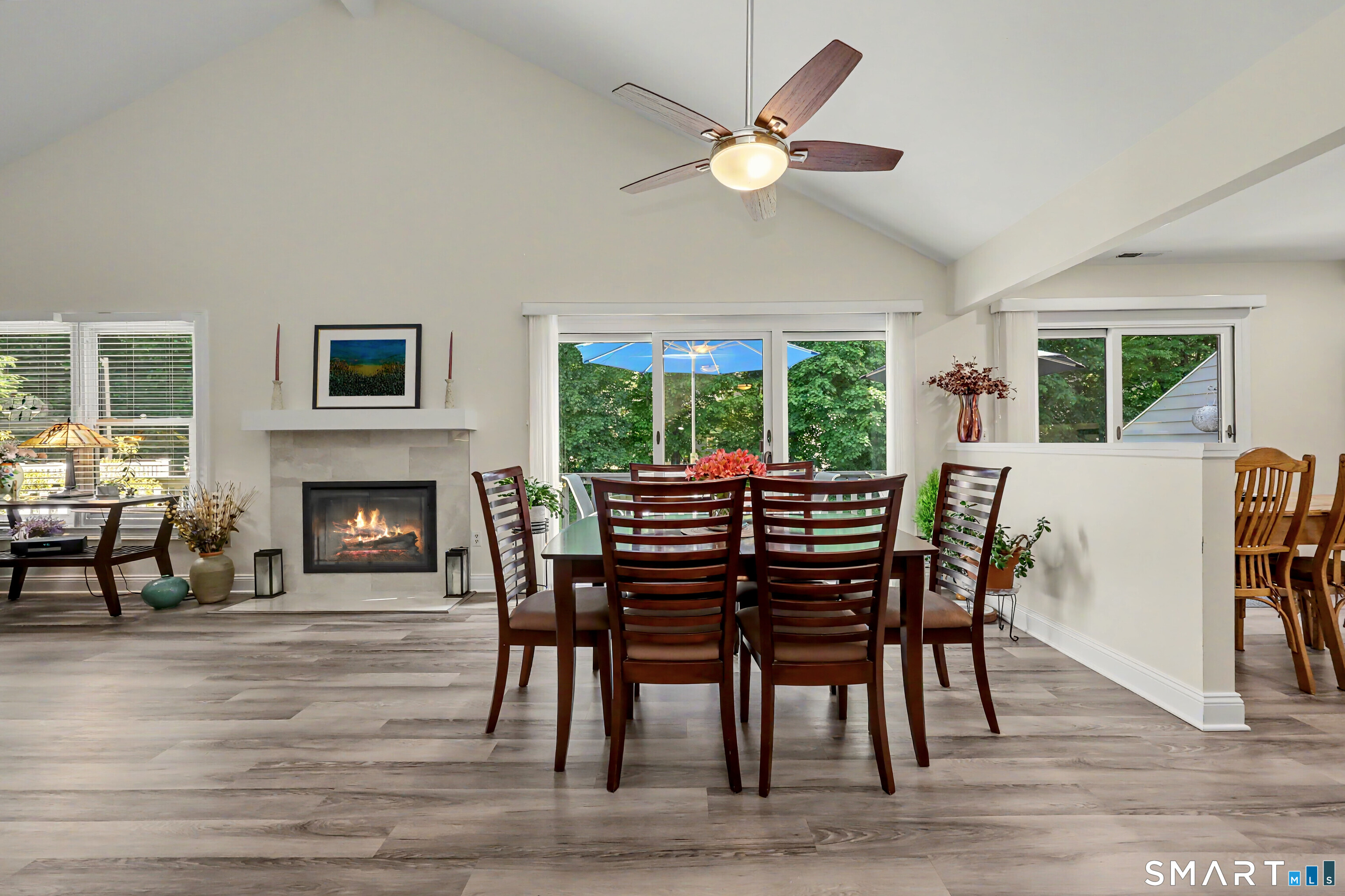 70 Fawn Ridge Lane, Unit 70 Norwalk, CT 06851 - Photo 6 of 36 a view of a dining room with furniture window and wooden floor