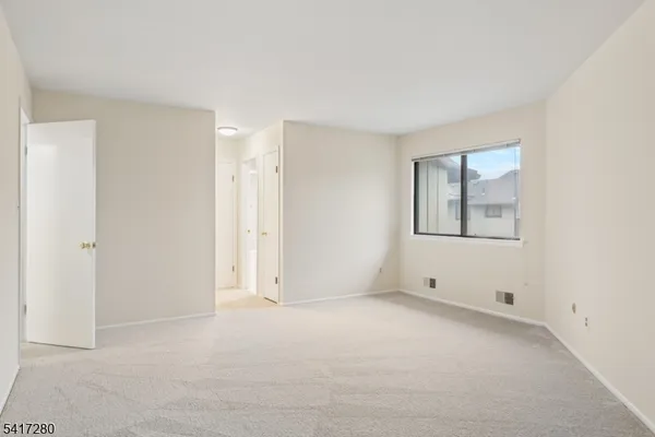 a bathroom with a granite countertop sink a mirror and a