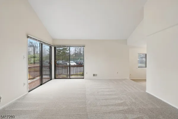 a view of an empty room with stairs