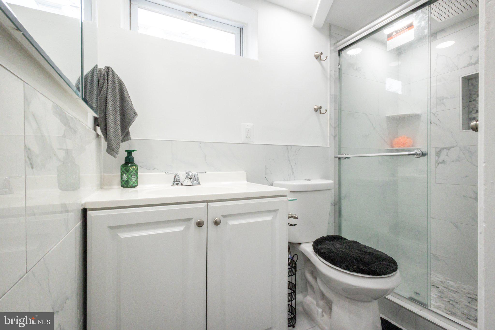 12007 Livingston Street Silver Spring, MD 20902 - Photo 12 of 16 Renovated Bathroom with Stand-Up Shower