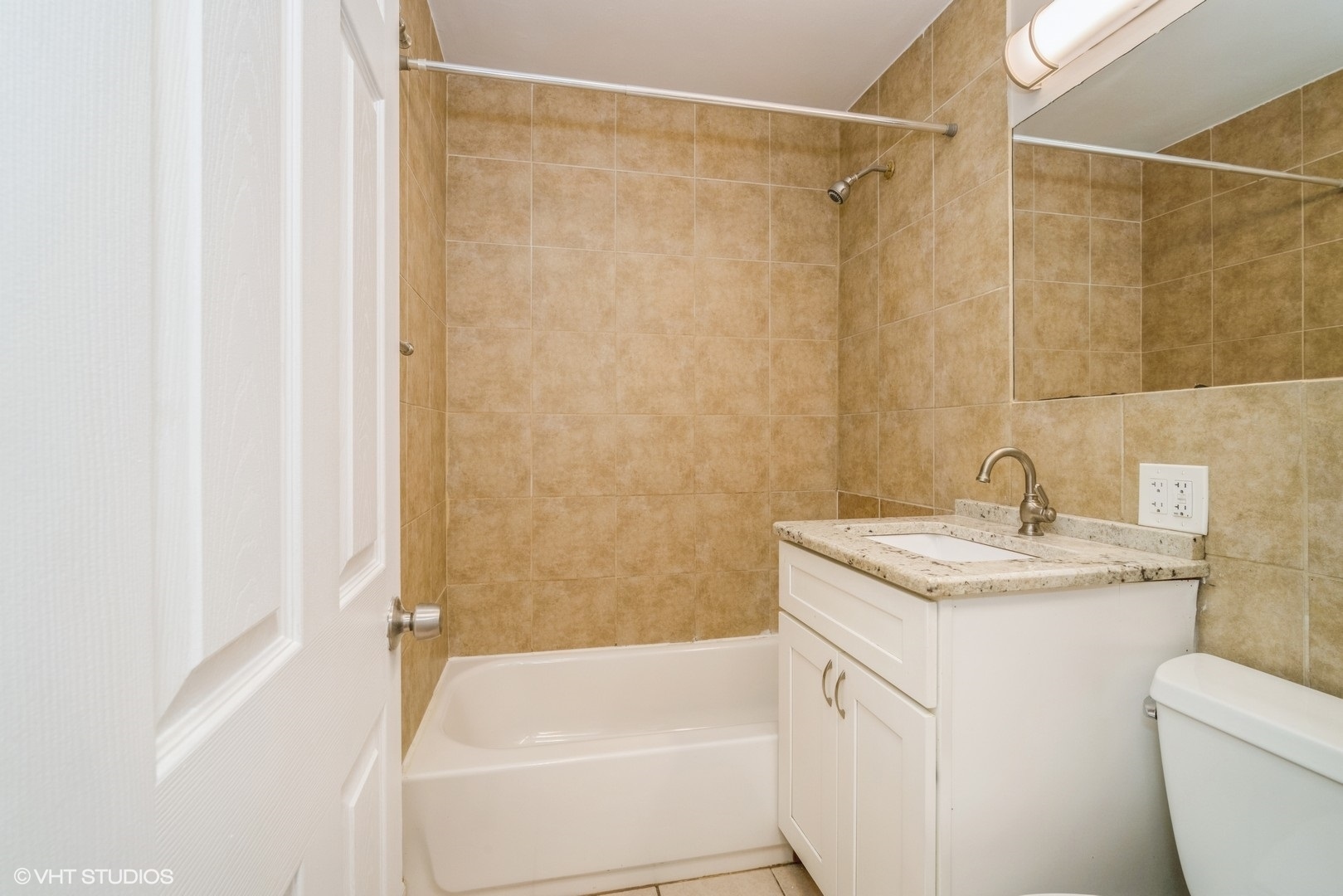 504 Isa Drive Wheeling, IL 60090 - Photo 8 of 13 a bathroom with a granite countertop sink toilet and shower