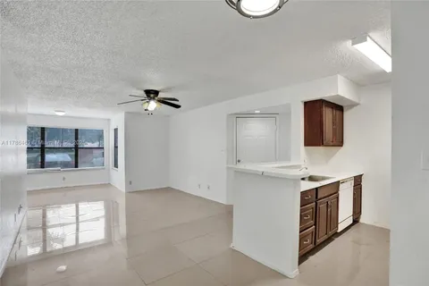a kitchen with a stove and a sink