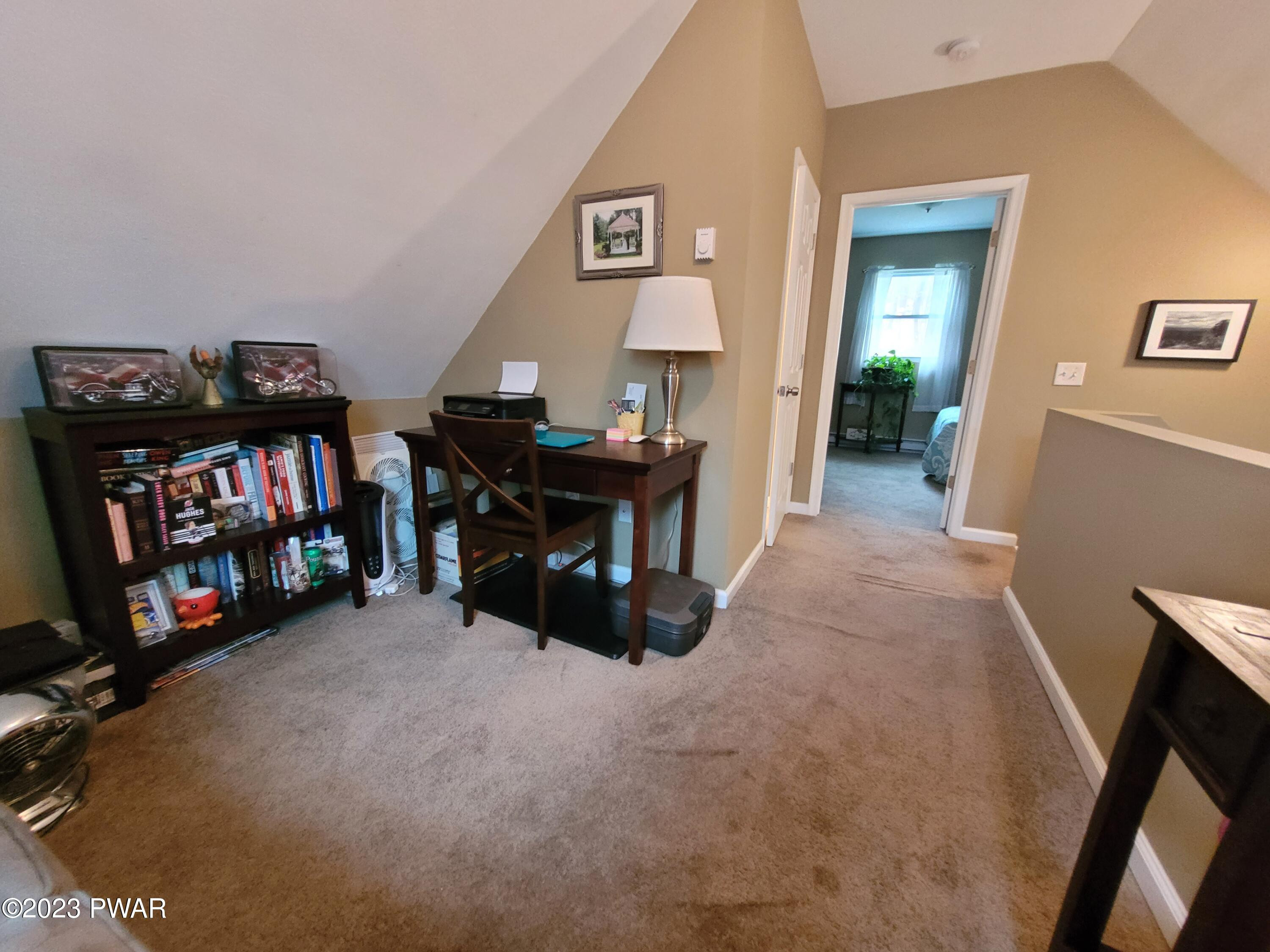 122 Hemlock Road Milford, PA 18337 - Photo 15 of 19 a view of a livingroom with a furniture and a flat screen tv