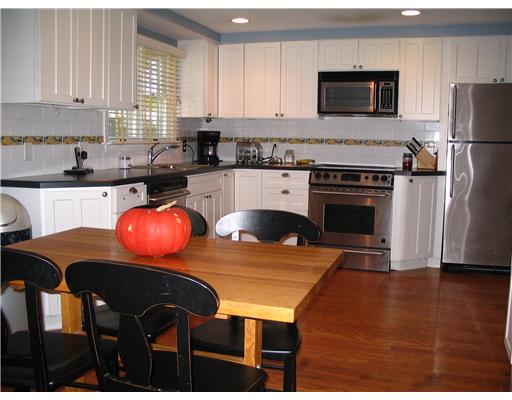 4 Peeptoad Road Warwick, RI 02888 - Photo 3 of 11 Kitchen. Eat in ktchen with updates of tile, hardwood,newer cabs, all stainless applliances! back door exits to deck and spacious yard,