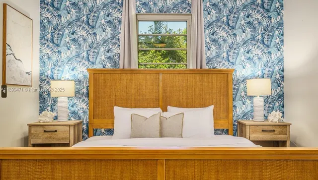 a bed room with a bed and a chair