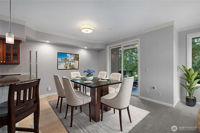 a view of a dining room with furniture window and wooden floor