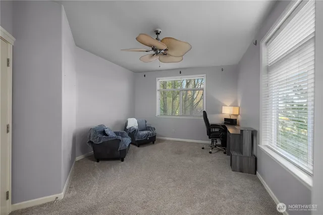 a view of workspace with furniture and a window