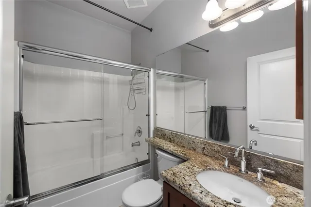 a utility room with sink dryer and washer