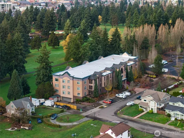 a aerial view of a house with garden swimming pool and outdoor seating