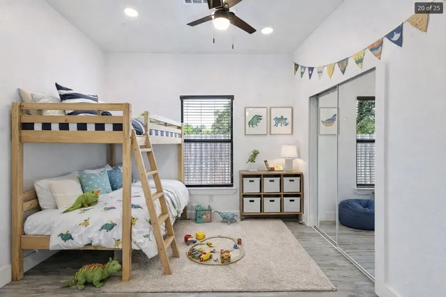 a bedroom with furniture and a wooden floor