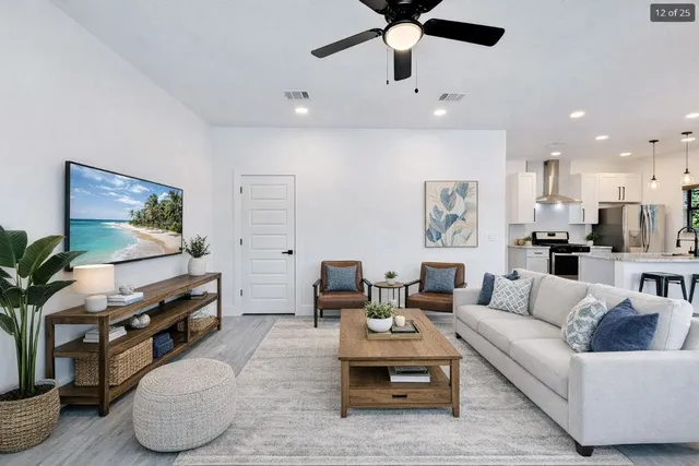 a living room with furniture and a flat screen tv