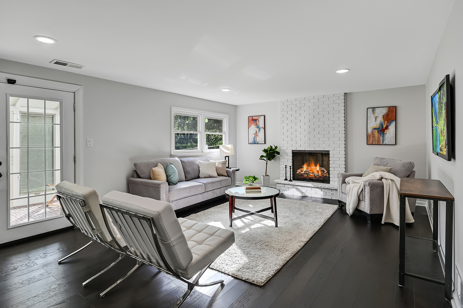 6725 Richmond Avenue Darien, IL 60561 - Photo 14 of 25 a living room with furniture a flat screen tv and a fireplace