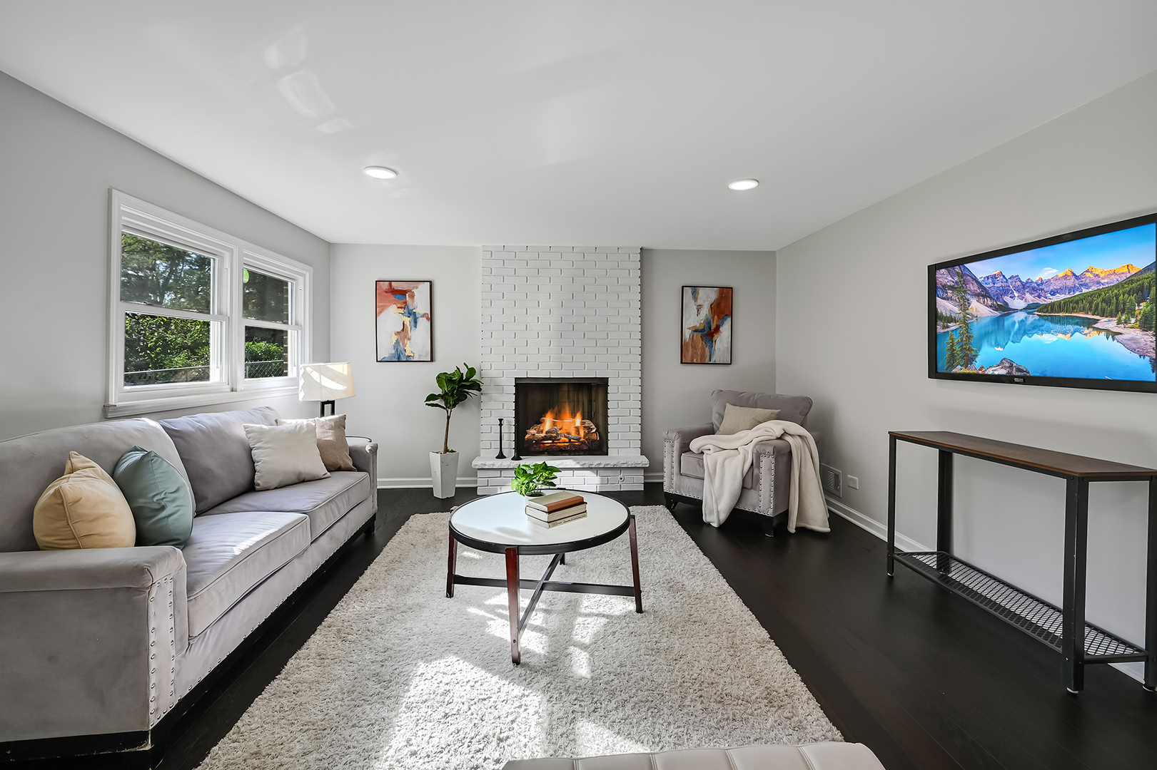 6725 Richmond Avenue Darien, IL 60561 - Photo 15 of 25 a living room with furniture a rug and a flat screen tv