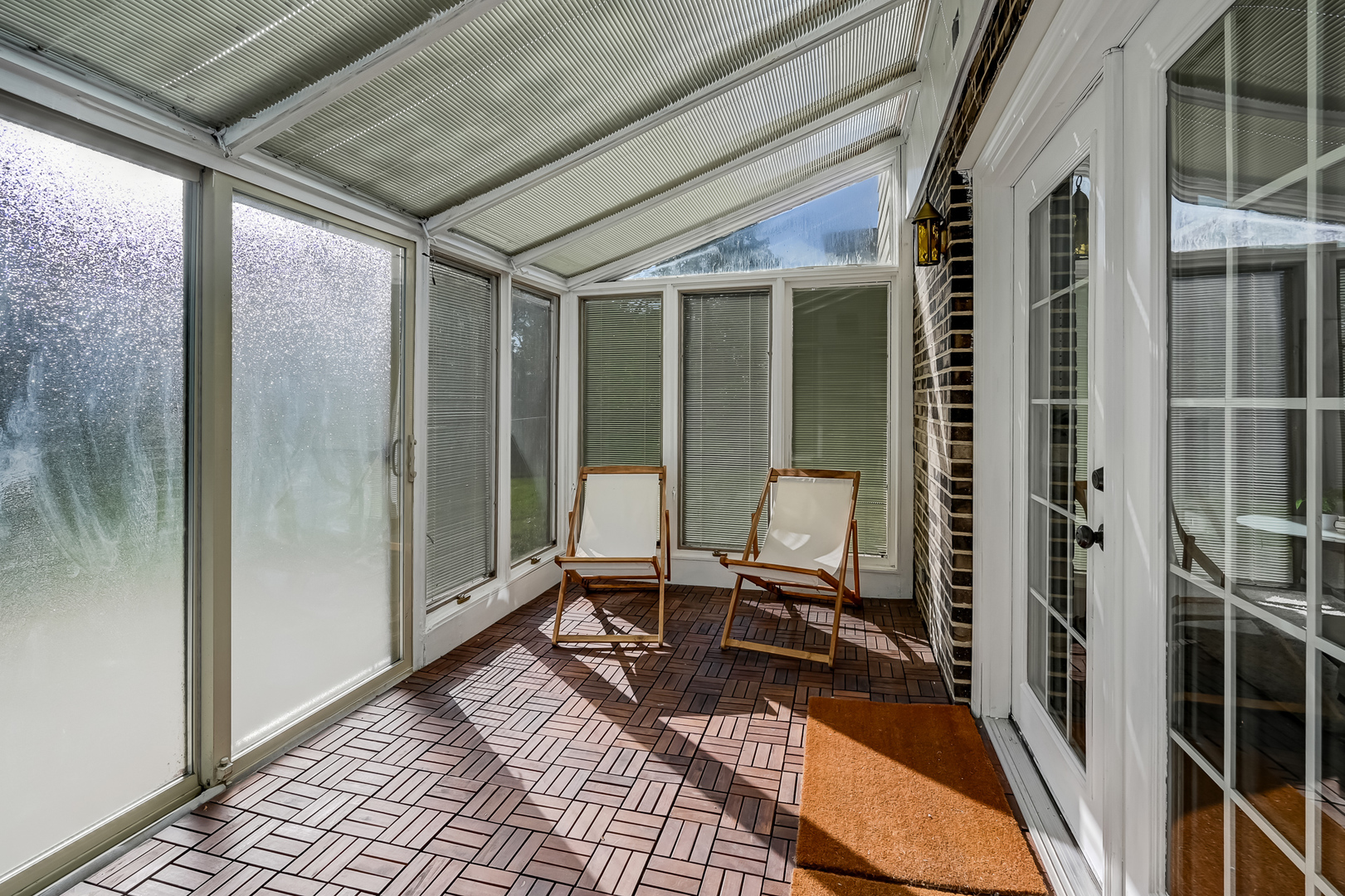 6725 Richmond Avenue Darien, IL 60561 - Photo 17 of 25 a balcony with chairs and glass door
