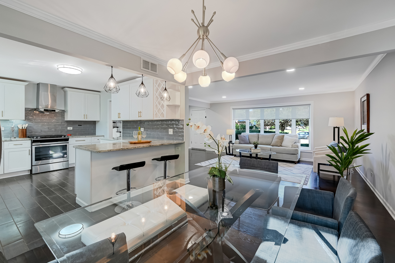6725 Richmond Avenue Darien, IL 60561 - Photo 5 of 25 a living room with furniture kitchen view and a chandelier