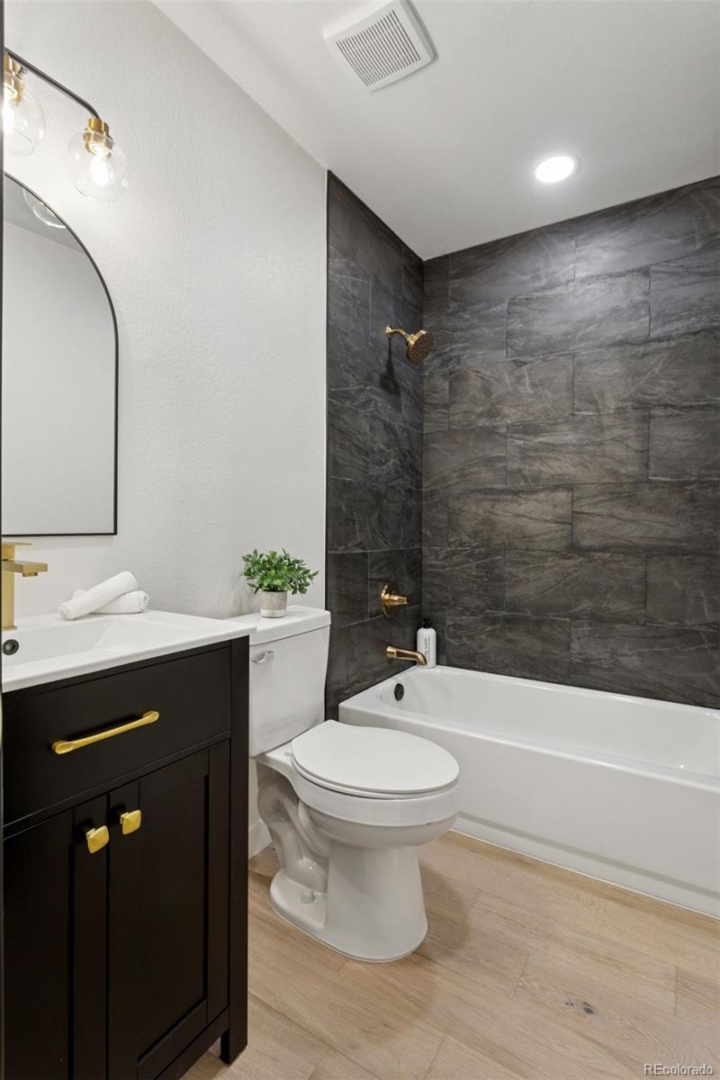 1091 Milo Circle, Unit B Lafayette, CO 80026 - Photo 20 of 33 a bathroom with a sink a toilet and shower