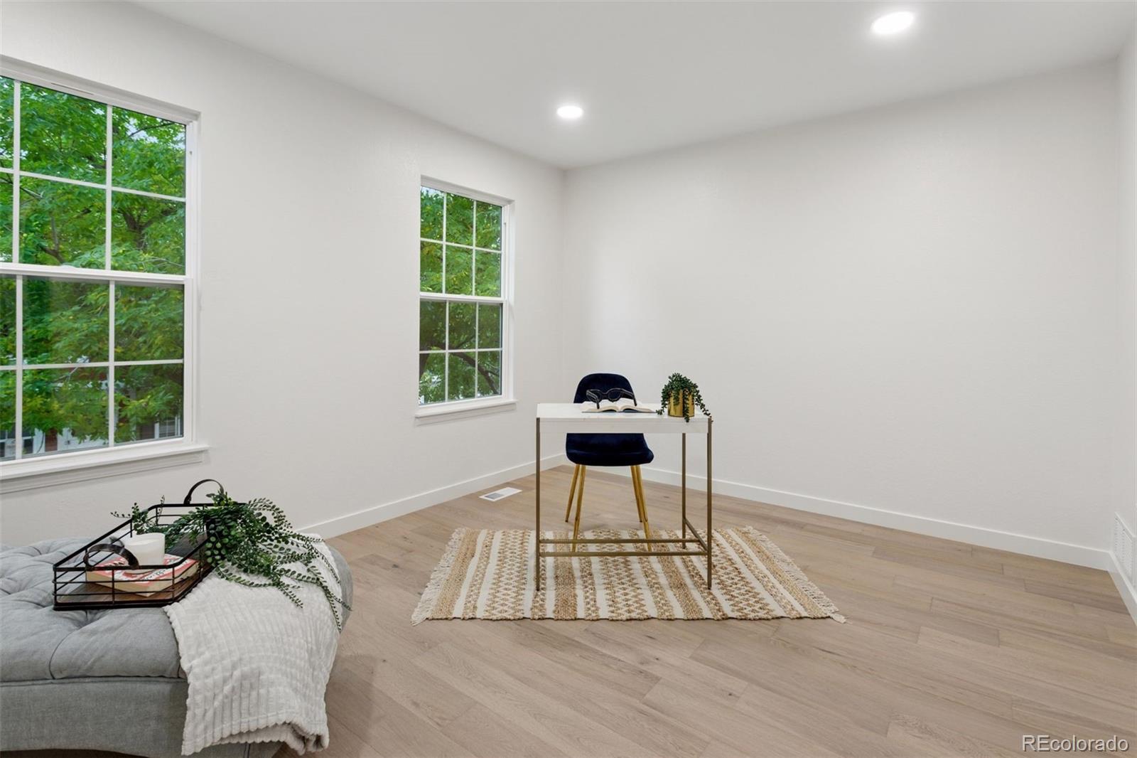 1091 Milo Circle, Unit B Lafayette, CO 80026 - Photo 21 of 33 a dining room with wooden floor and a potted plant