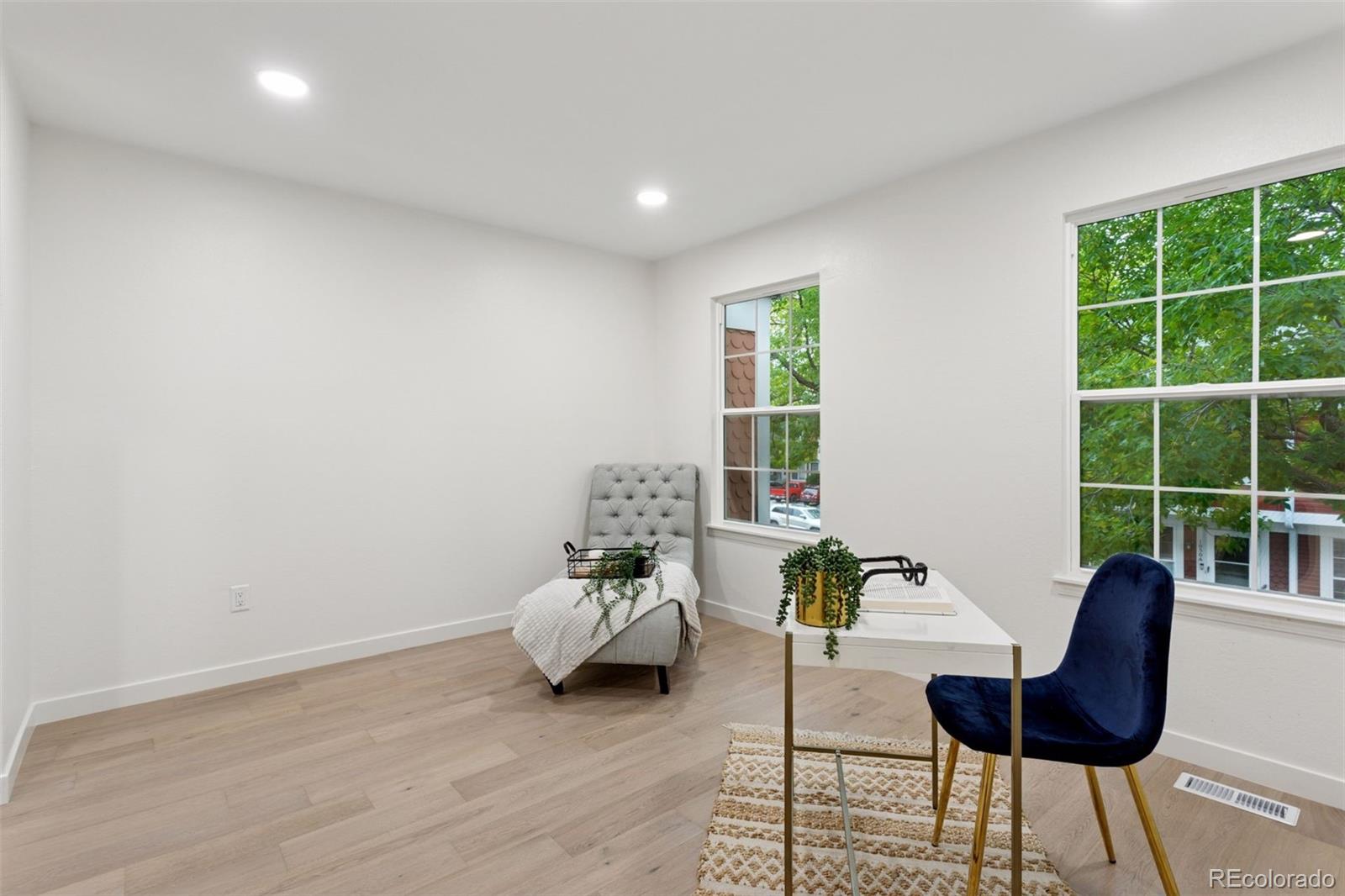 1091 Milo Circle, Unit B Lafayette, CO 80026 - Photo 22 of 33 a living room with furniture and a window