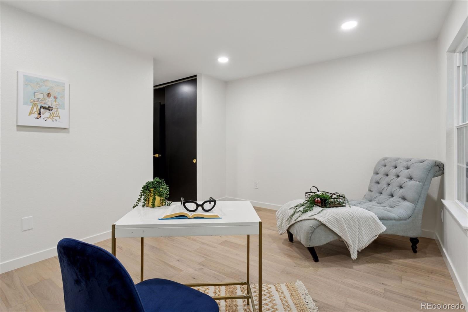 1091 Milo Circle, Unit B Lafayette, CO 80026 - Photo 23 of 33 a view of a livingroom with furniture and wooden floor