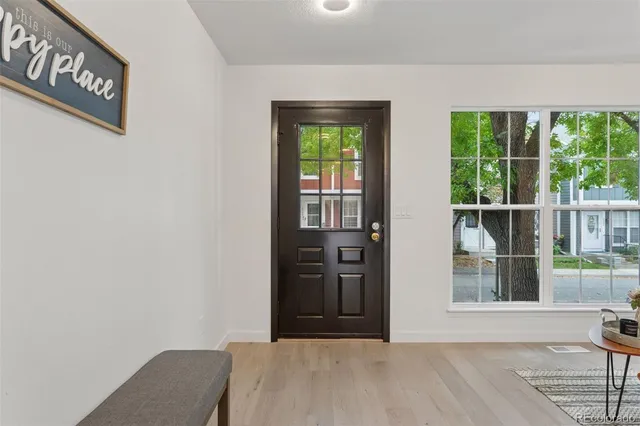 a view of a livingroom with furniture and wooden floor