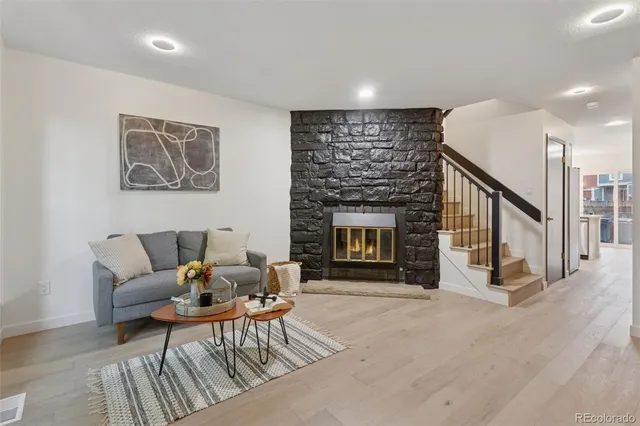 a view of a house with a yard and sitting area