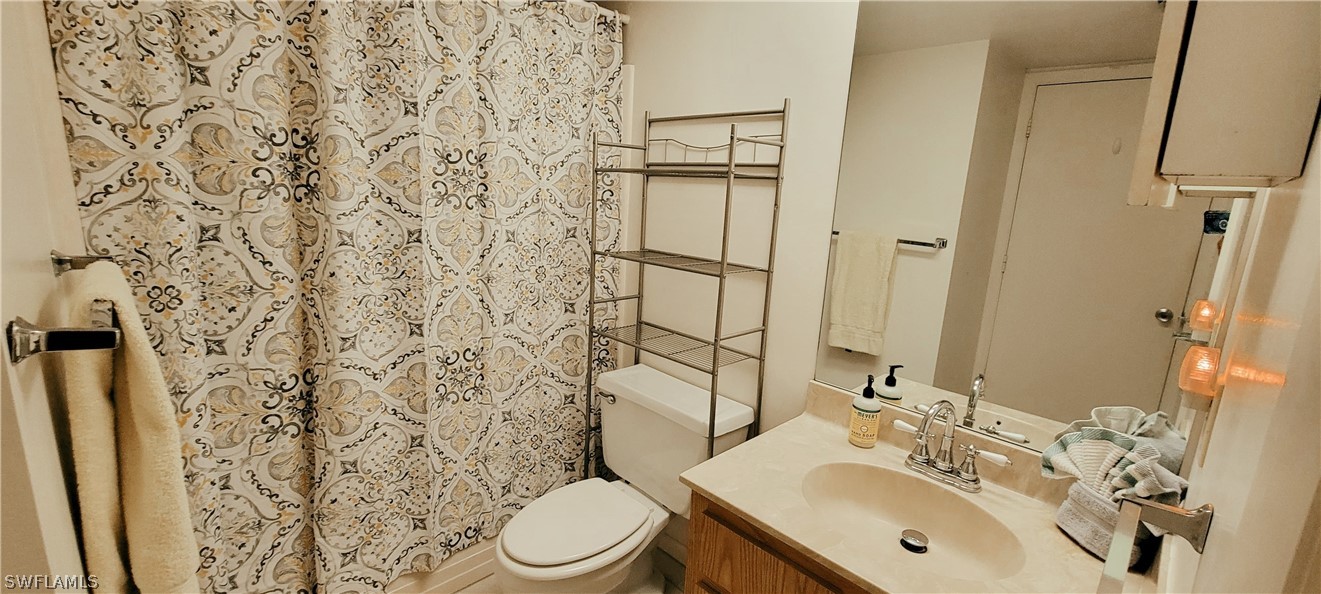 1022 Manatee Road, Unit D206 Naples, FL 34114 - Photo 13 of 21 a bathroom with a sink toilet and shower
