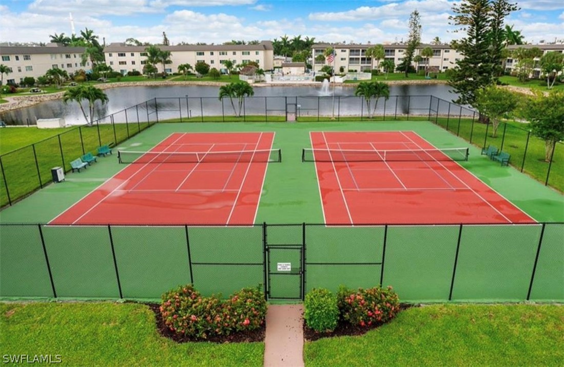 1022 Manatee Road, Unit D206 Naples, FL 34114 - Photo 21 of 21 a backyard of a house with a lake view and lake view