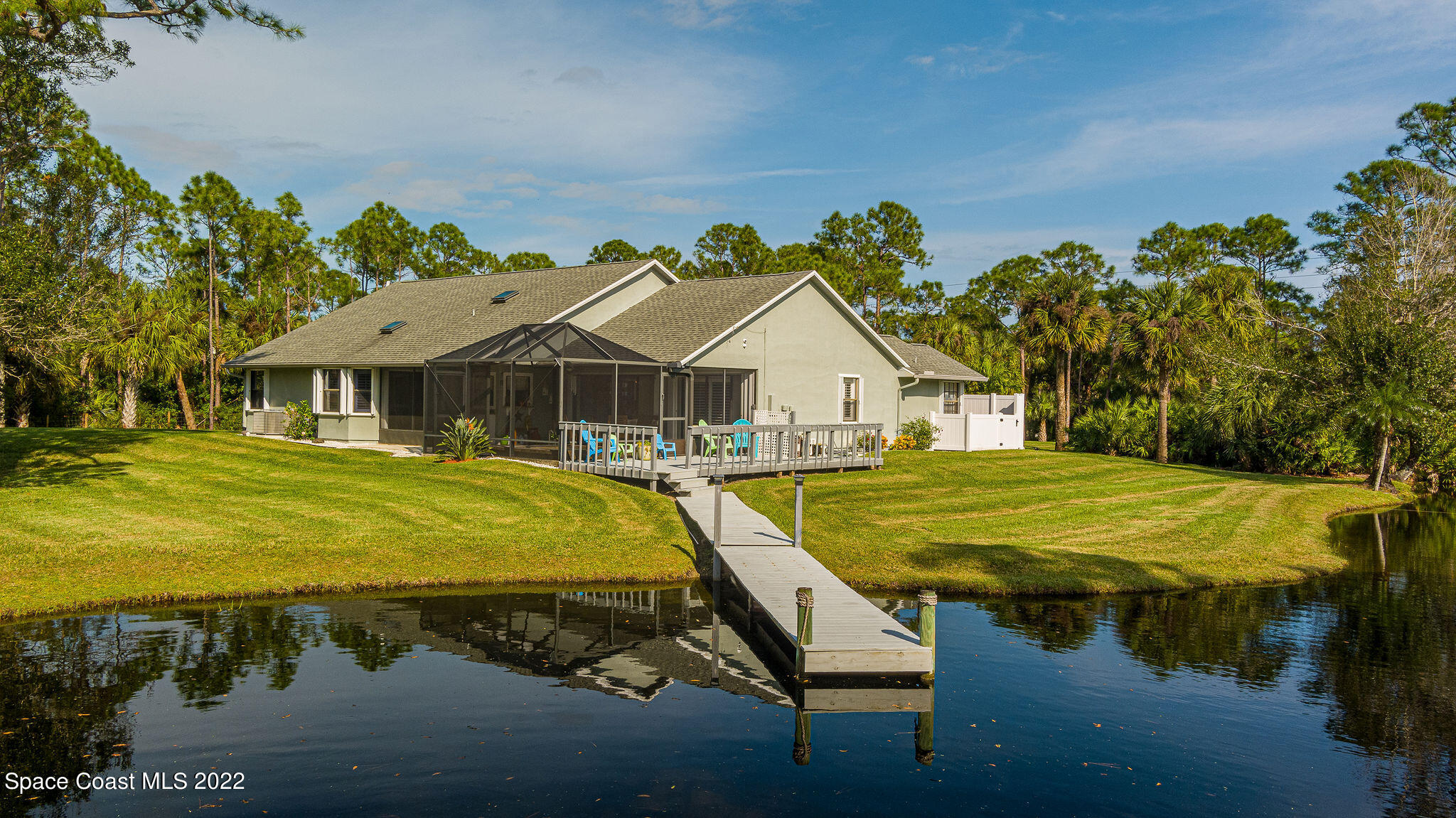 3500 Corey Road Malabar, FL 32950 - Photo 1 of 122 a house with swimming pool in front of it