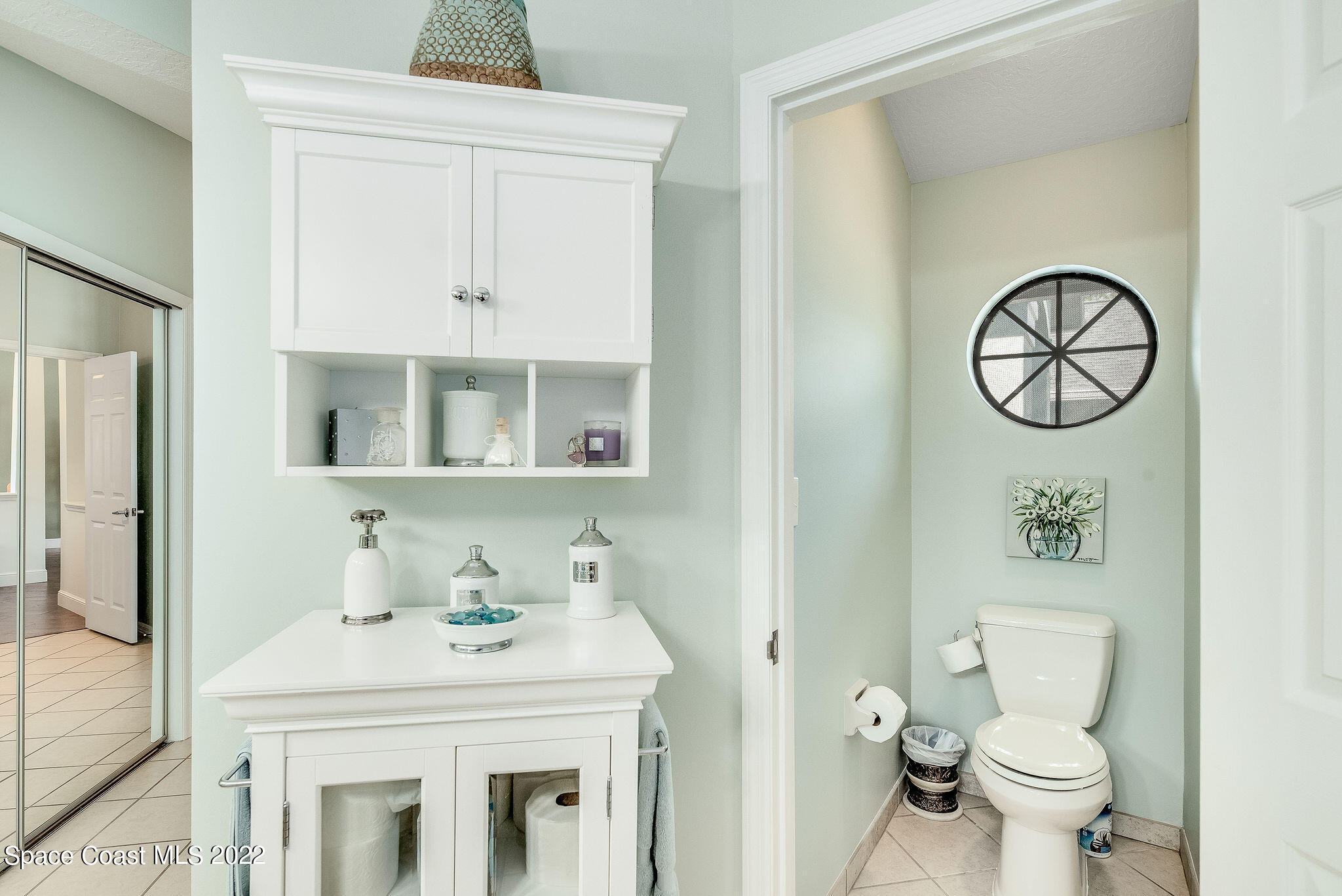 3500 Corey Road Malabar, FL 32950 - Photo 17 of 122 a bathroom with a sink and a mirror