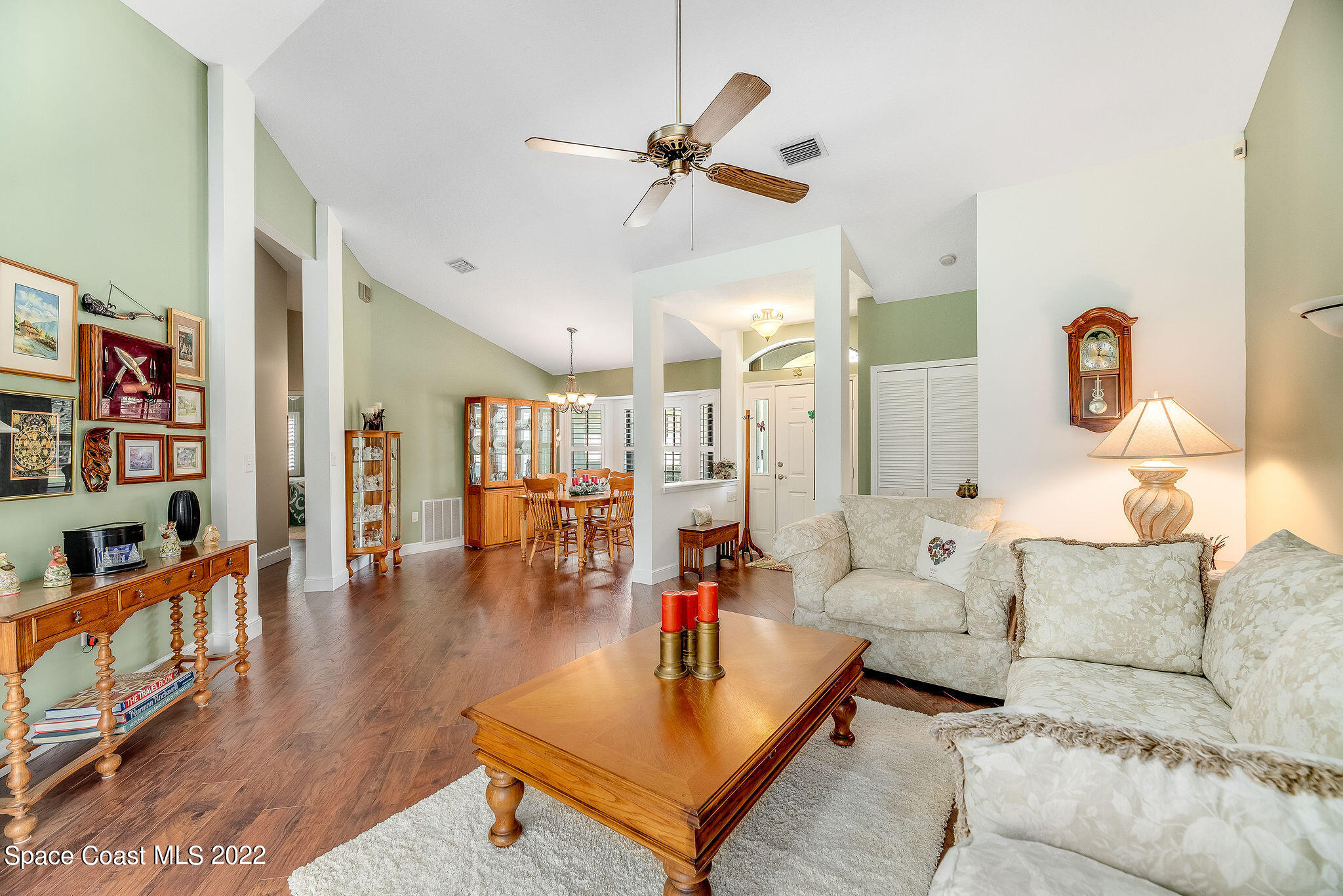 3500 Corey Road Malabar, FL 32950 - Photo 20 of 122 a living room with furniture and a book shelf