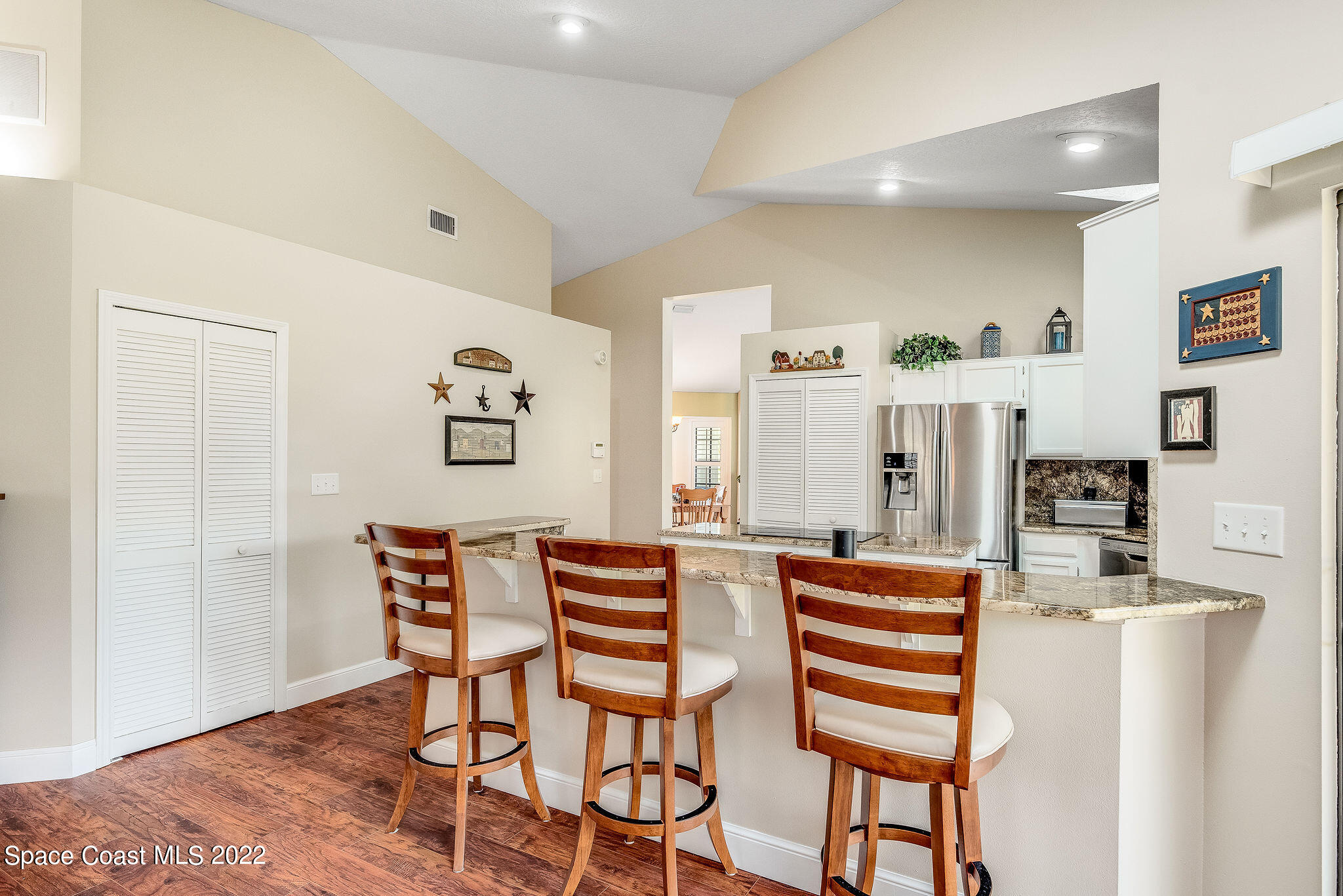3500 Corey Road Malabar, FL 32950 - Photo 26 of 122 a dining room with furniture and wooden floor