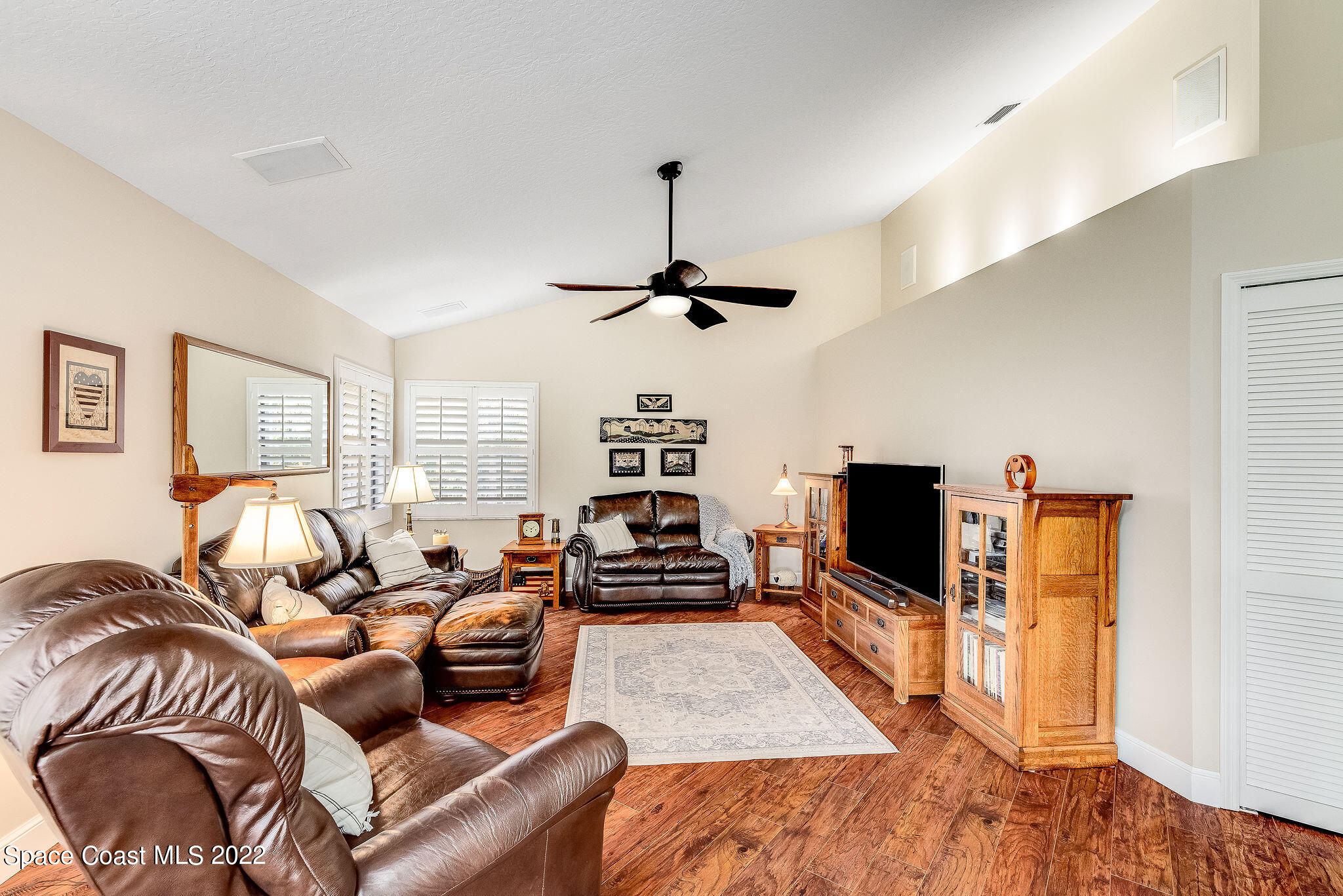 3500 Corey Road Malabar, FL 32950 - Photo 27 of 122 a living room with furniture and a flat screen tv