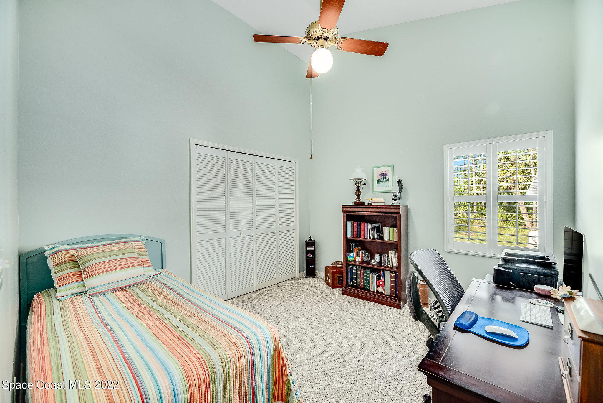 3500 Corey Road Malabar, FL 32950 - Photo 38 of 122 a bedroom with a bed and a chandelier