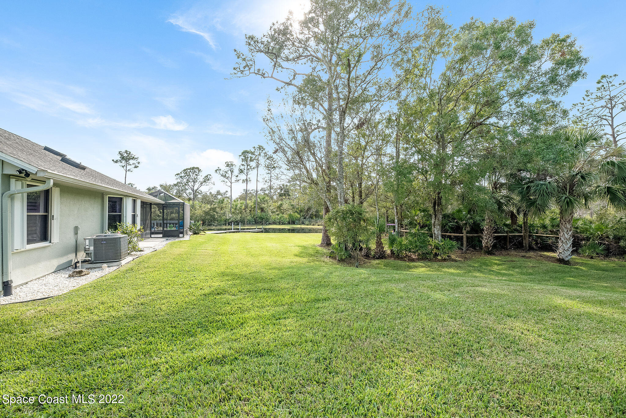 3500 Corey Road Malabar, FL 32950 - Photo 58 of 122 a swimming pool with outdoor seating and yard