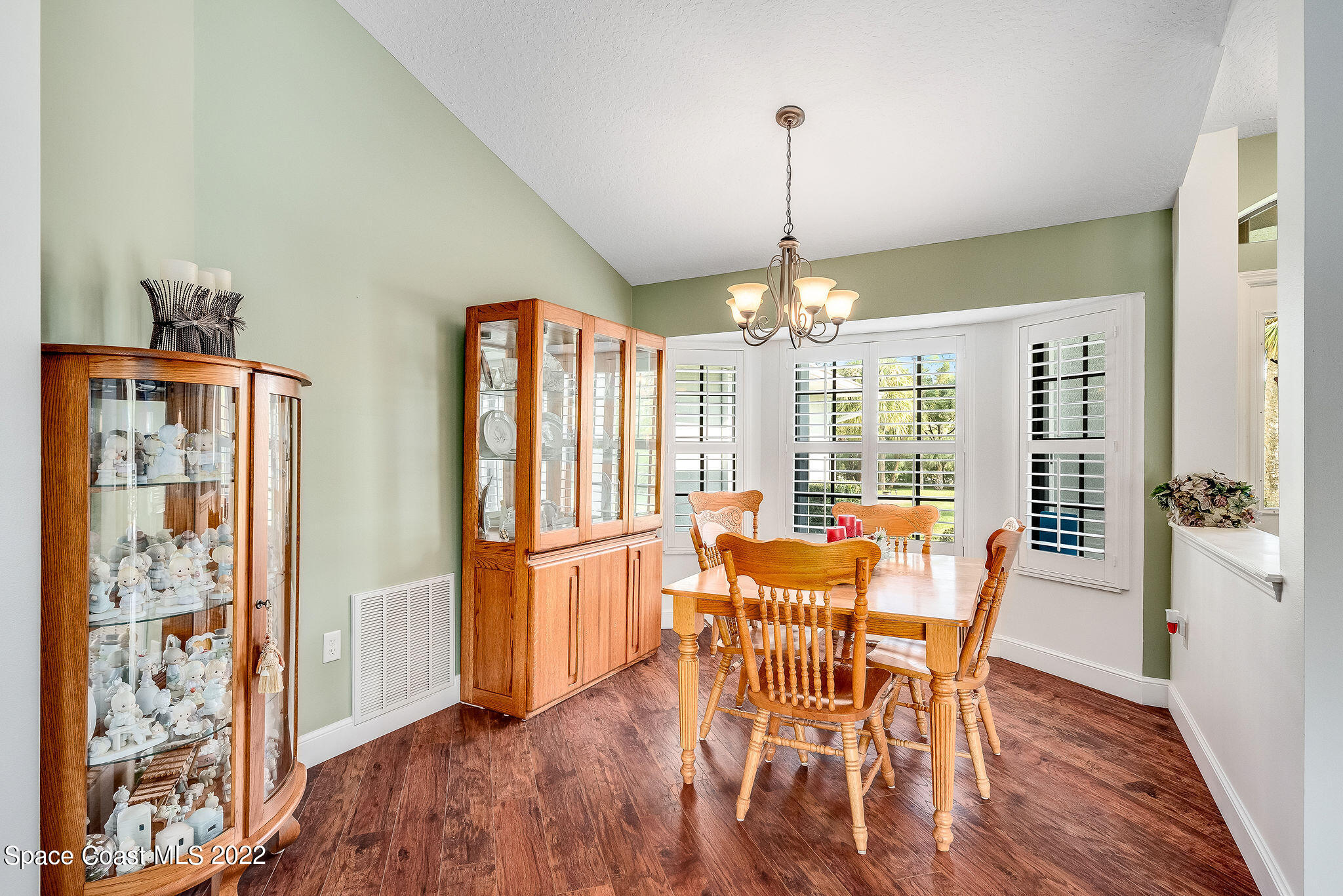 3500 Corey Road Malabar, FL 32950 - Photo 9 of 122 a view of a dining room with furniture window and wooden floor