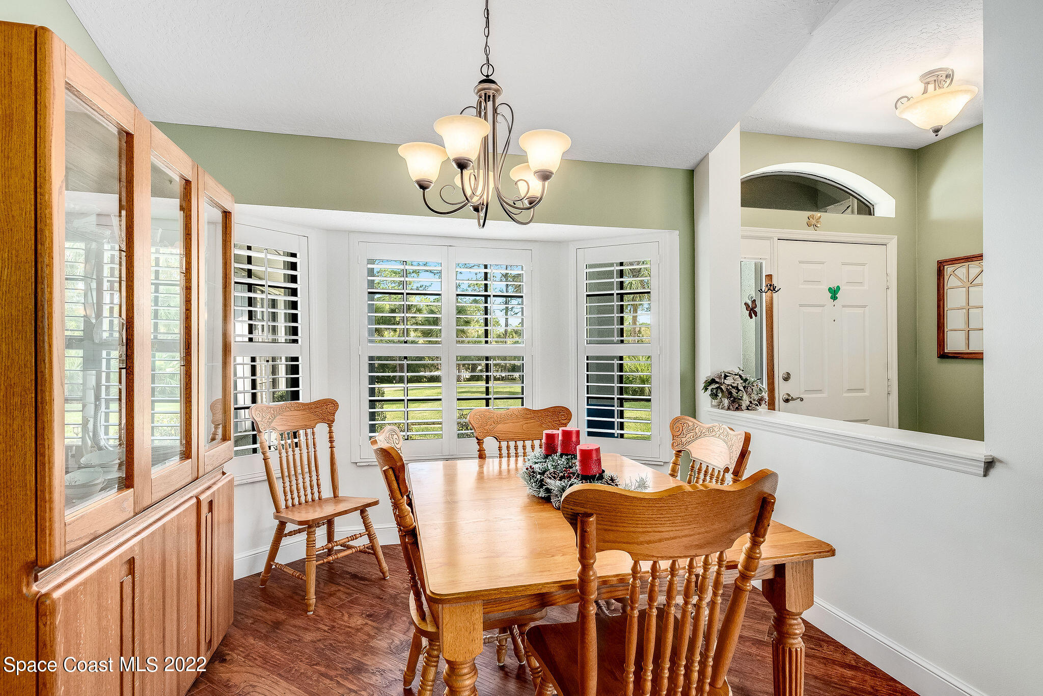 3500 Corey Road Malabar, FL 32950 - Photo 10 of 122 a view of a dining room with furniture large windows and wooden floor