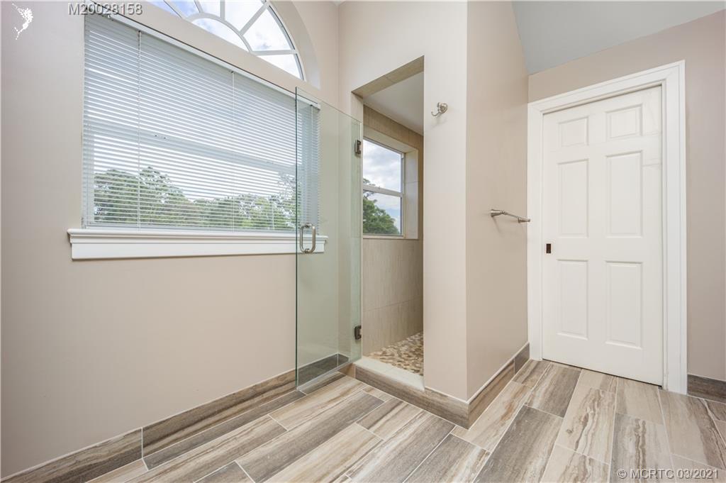 669 Southwest Linden Street Stuart, FL 34997 - Photo 18 of 43 Main Bedroom with large walk in shower