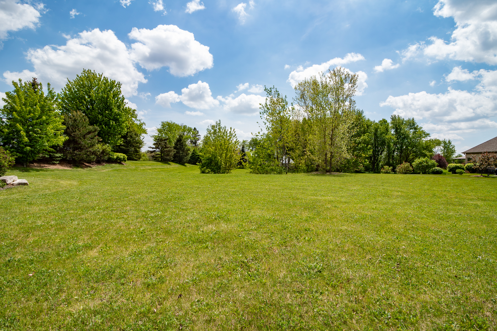 2601 Sanctuary Lane Spring Grove, IL 60081 - Photo 3 of 11 a view of a big yard with swimming pool and outdoor seating