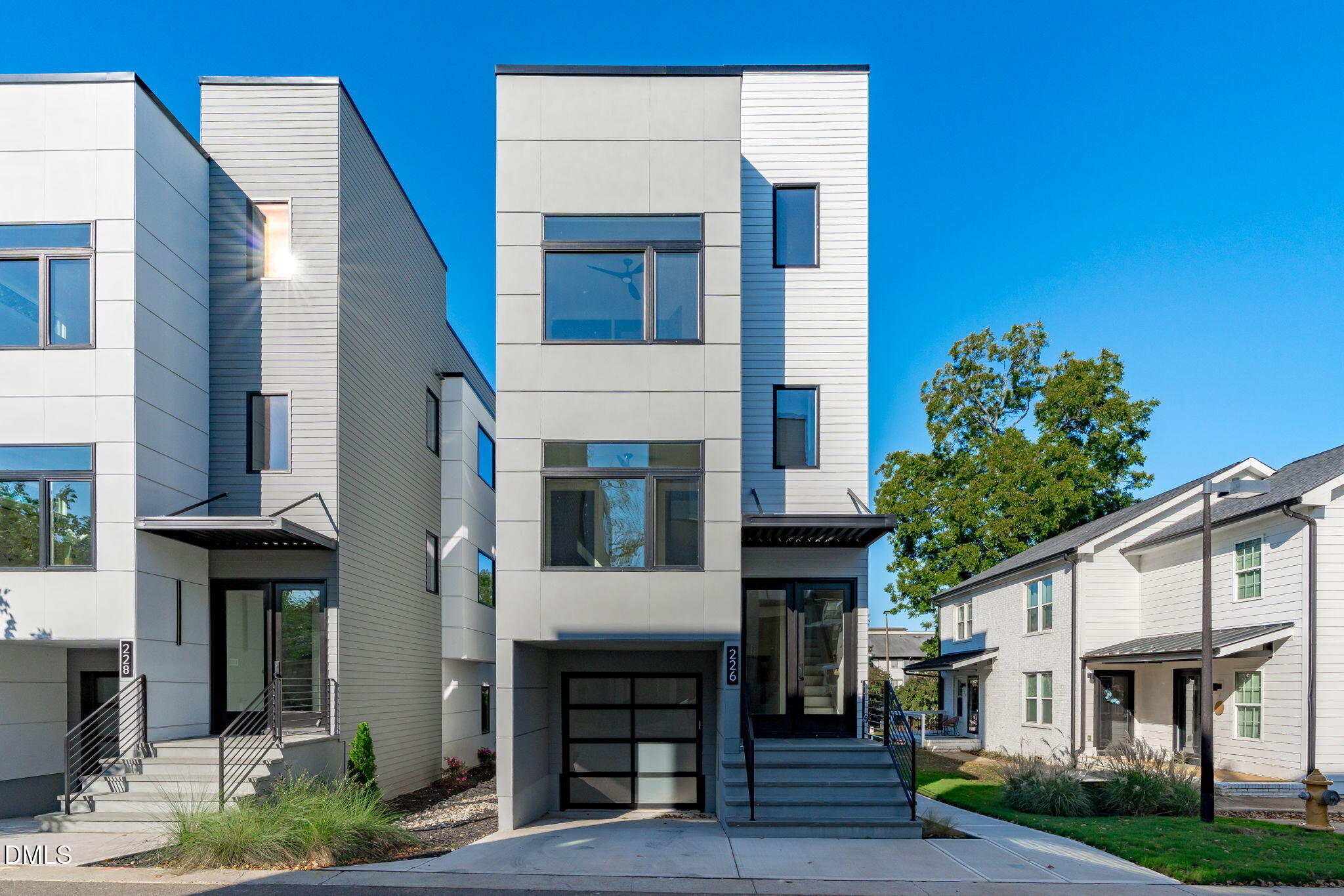 226 Woodsborough Place Raleigh, NC 27601 - Photo 1 of 42 a front view of a house with a yard