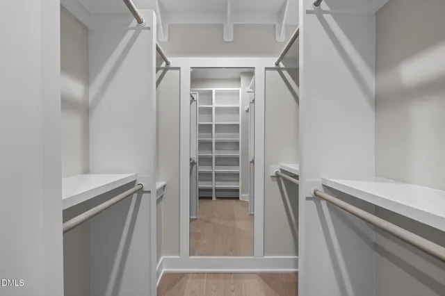 a view of hallway with a large window and stairs