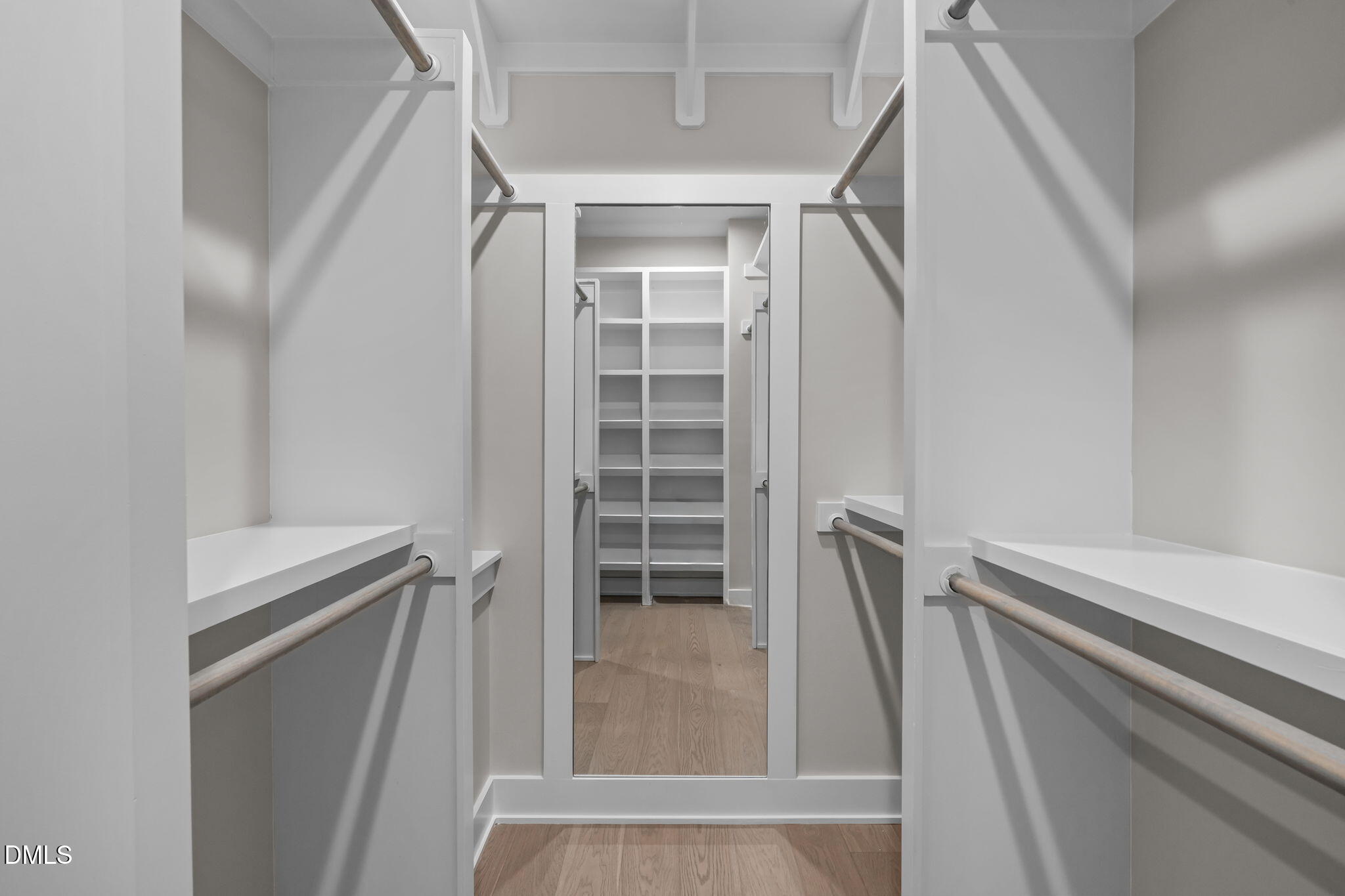 226 Woodsborough Place Raleigh, NC 27601 - Photo 22 of 42 a view of walk in closet with empty racks