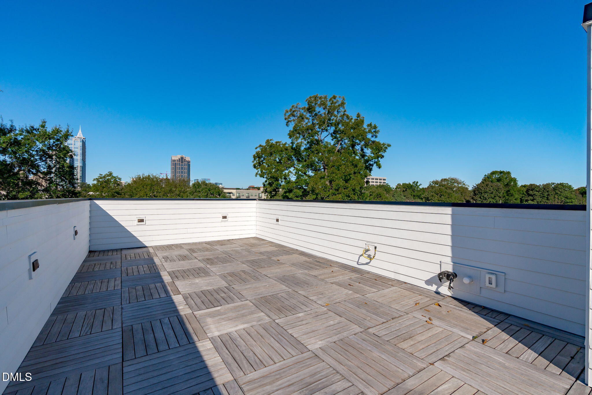 226 Woodsborough Place Raleigh, NC 27601 - Photo 27 of 42 a view of an outdoor space with wooden floor and lake view
