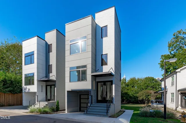 a front view of a building with garden