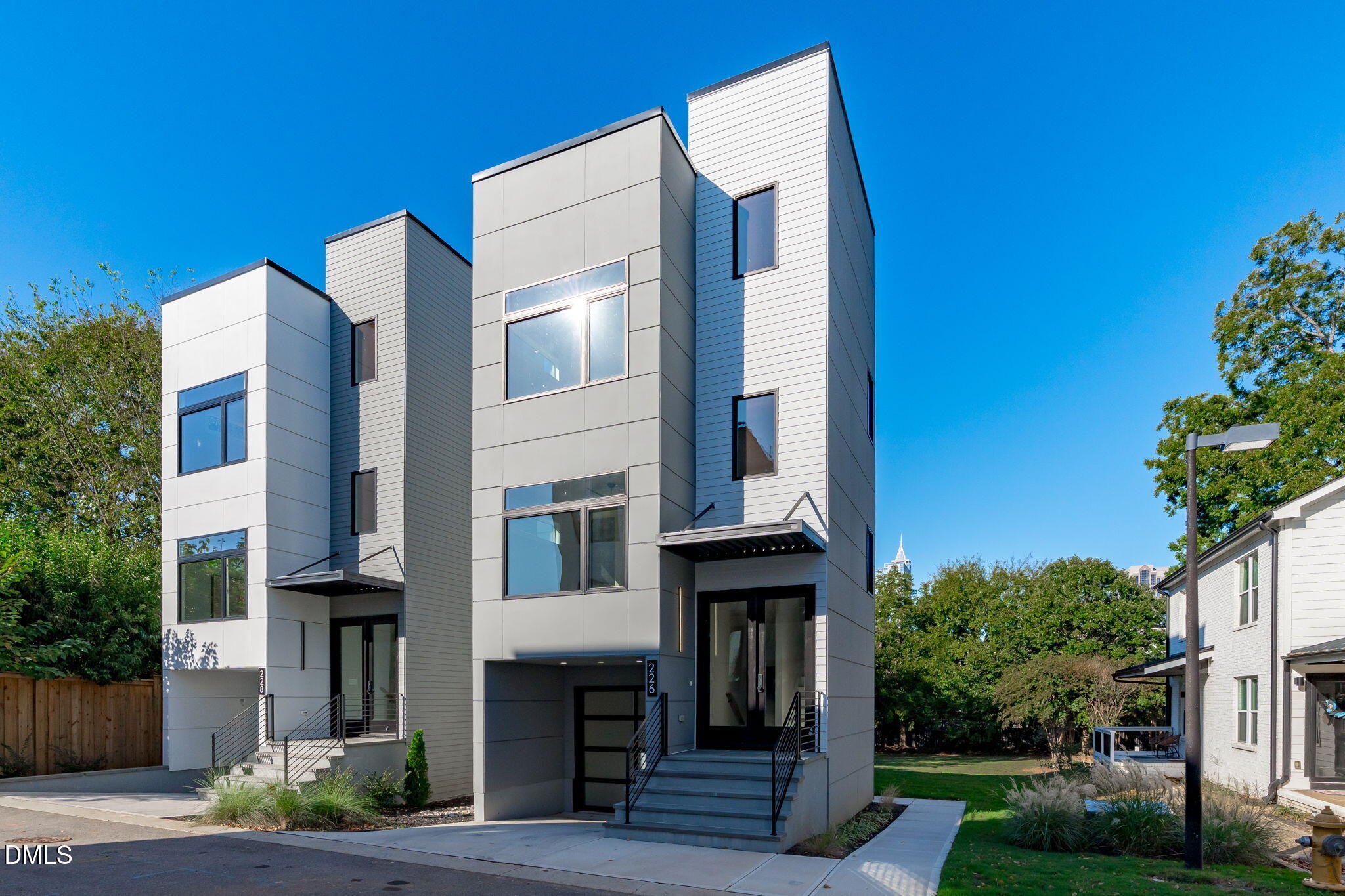 226 Woodsborough Place Raleigh, NC 27601 - Photo 2 of 42 a front view of a building with garden