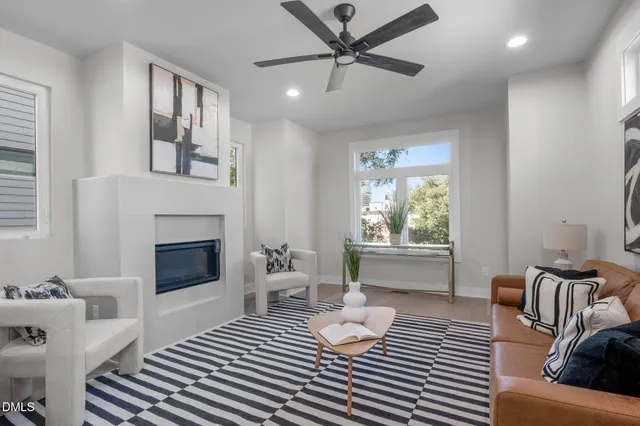 a bedroom with furniture and a fireplace