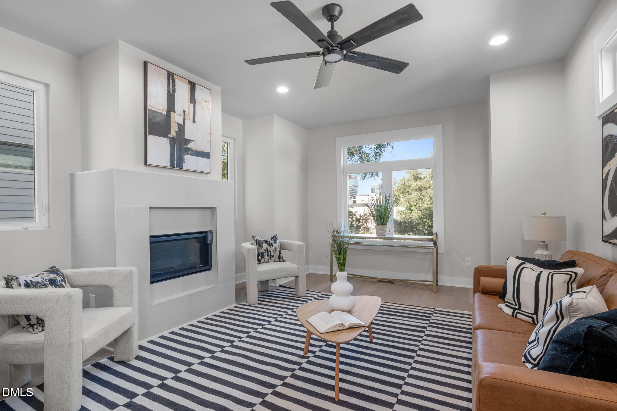 226 Woodsborough Place Raleigh, NC 27601 - Photo 4 of 42 a bedroom with furniture and a fireplace