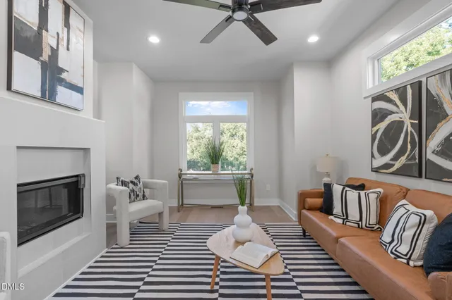 a bedroom with furniture and a fireplace