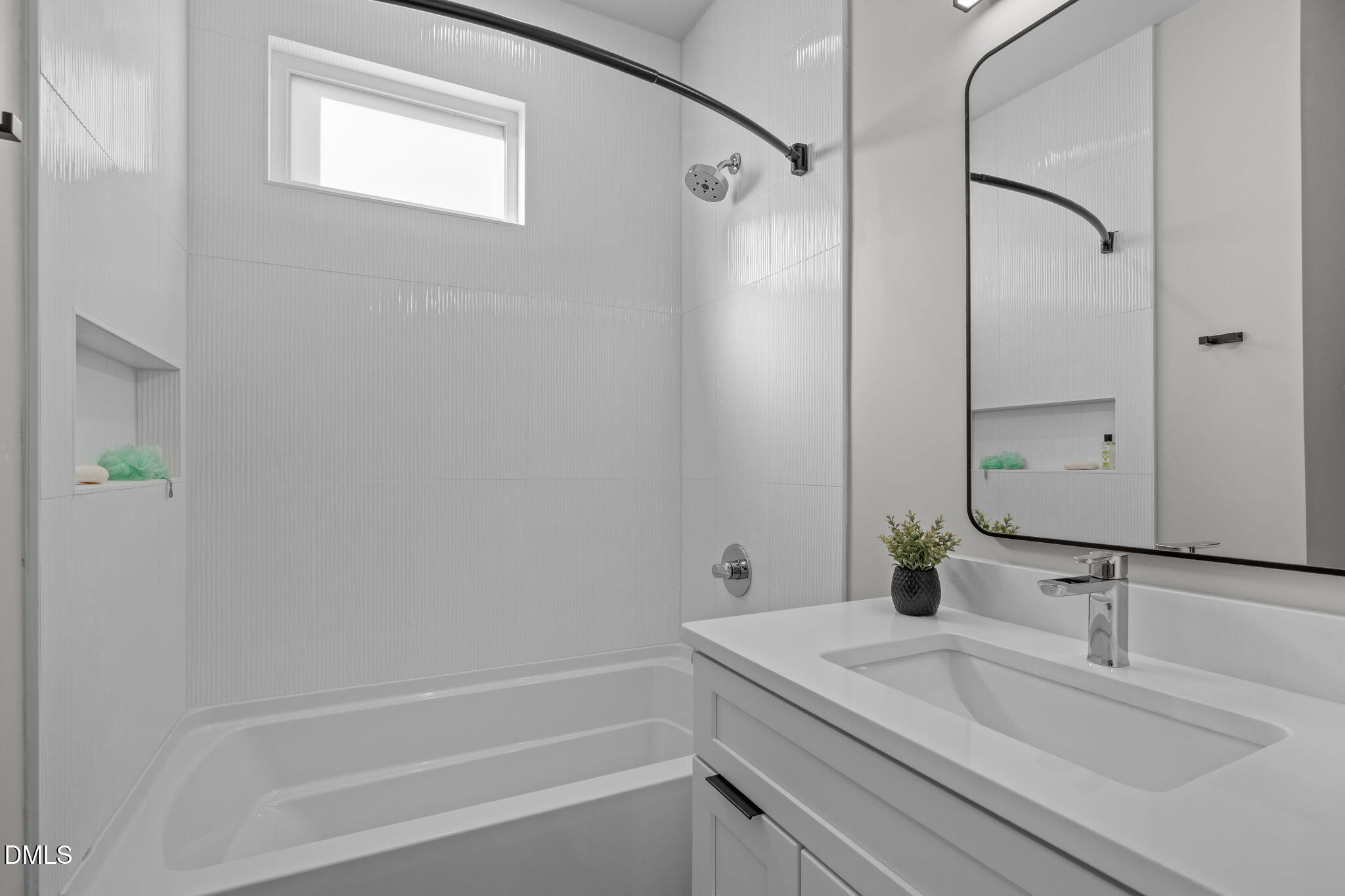 226 Woodsborough Place Raleigh, NC 27601 - Photo 8 of 42 a bathroom with a sink and a mirror