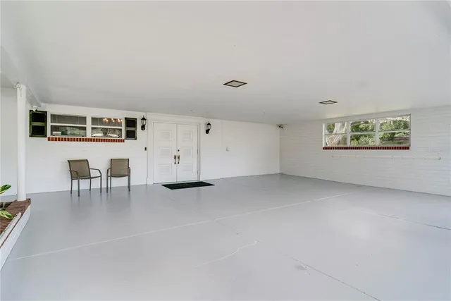 a bedroom with furniture and window