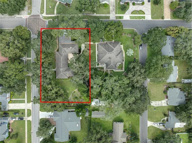 an aerial view of house with yard swimming pool and outdoor seating